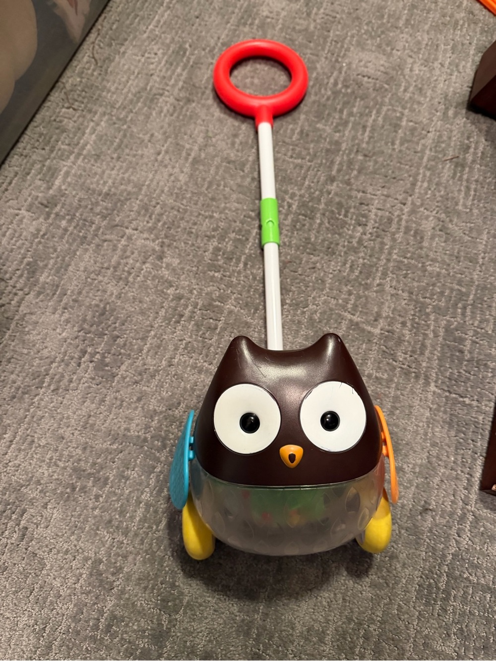 Skip Hop Brown Owl Push Toy with Red Handle and Yellow Wheels